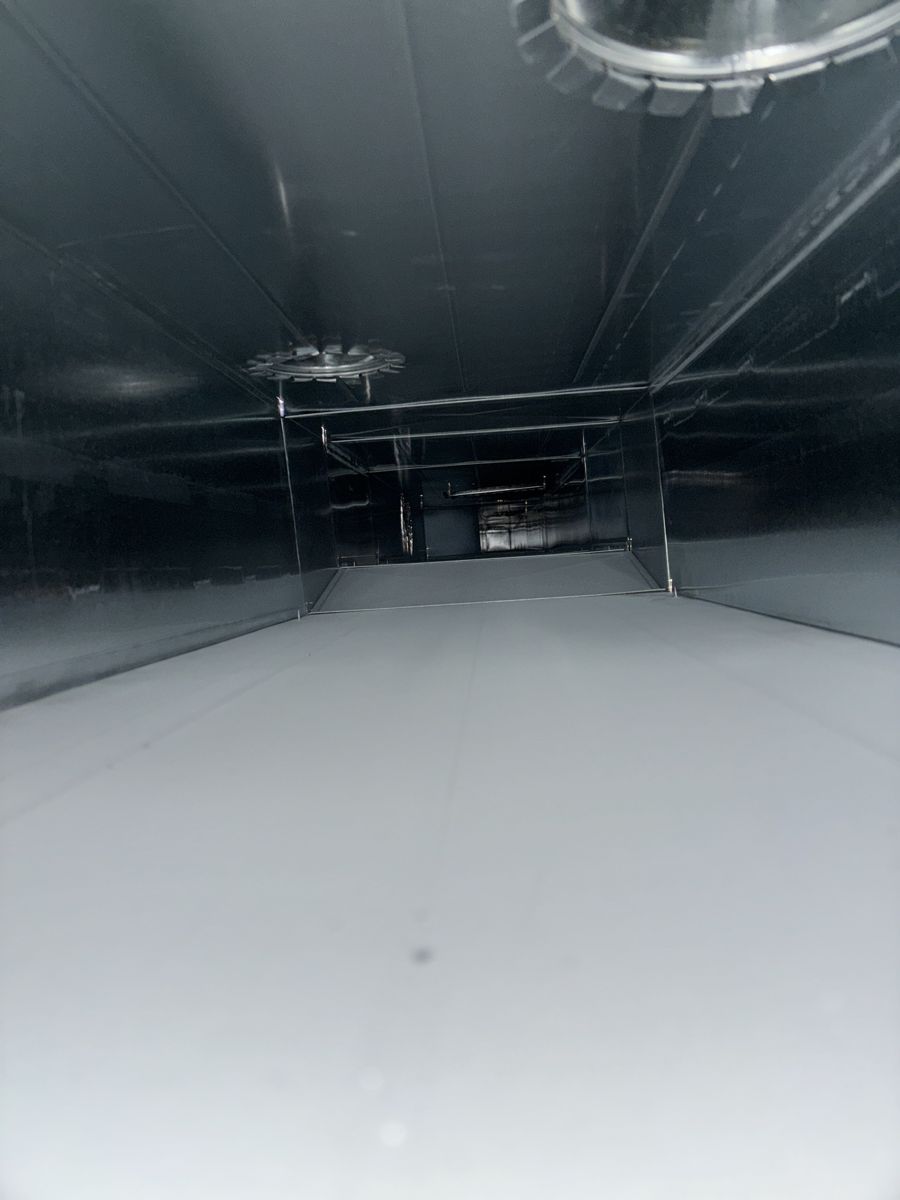 Rectangular trunk duct with a grey dust film before cleaning