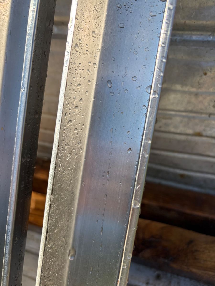 Kitchen hood filter channels from the same job after cleaning, clean steel