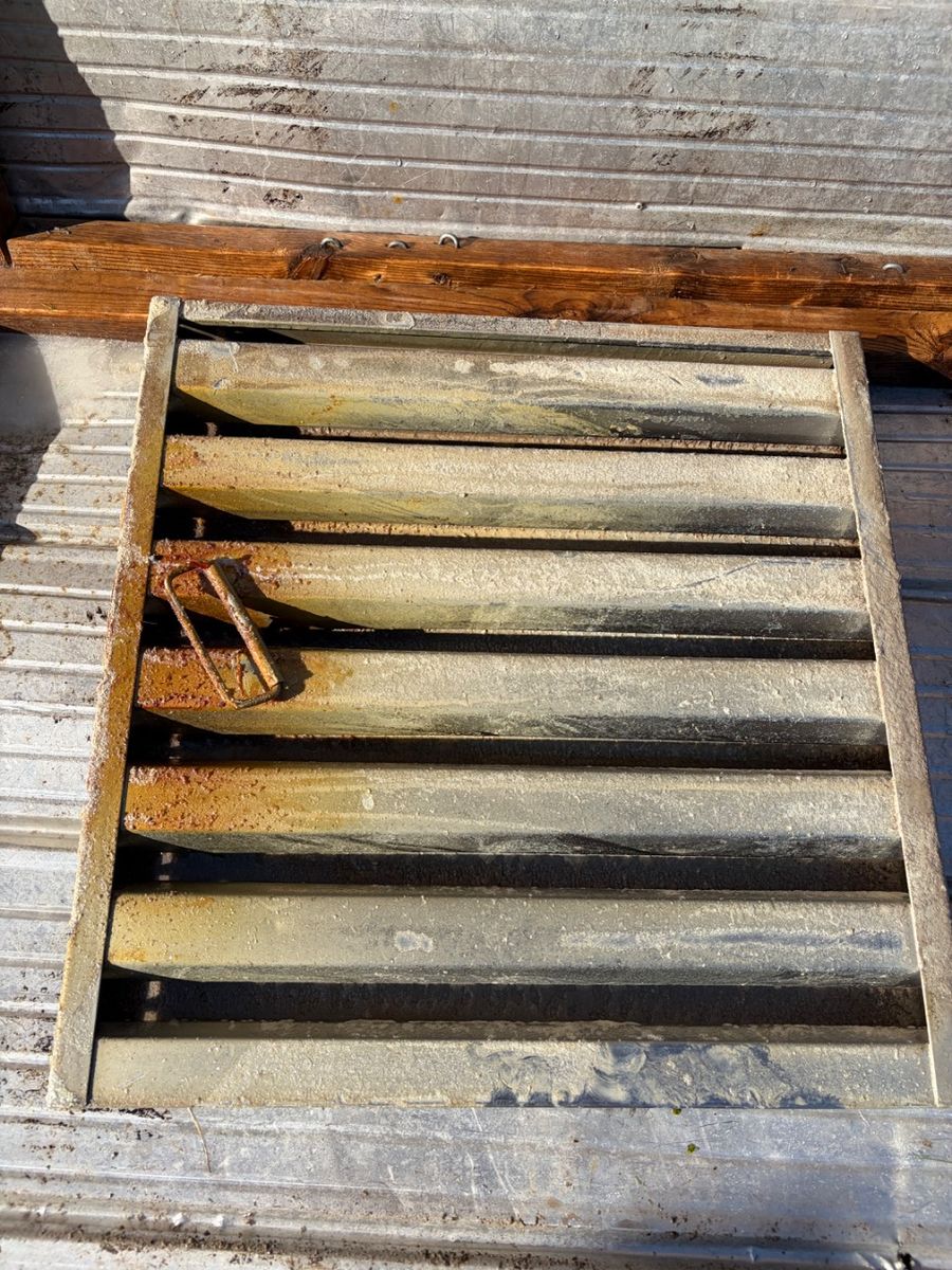 Kitchen hood filter with buildup across the baffles before cleaning