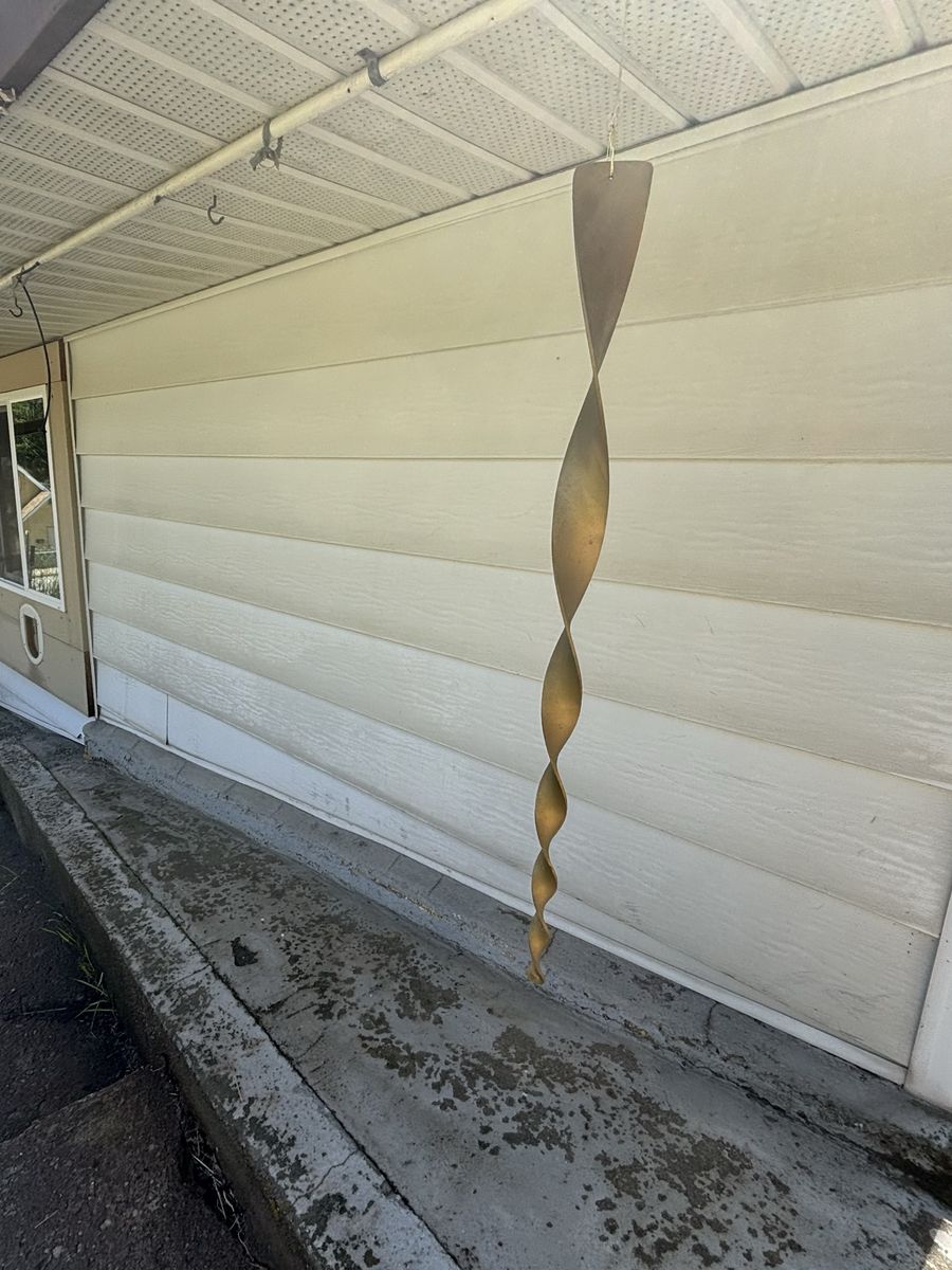 The same wall after a soft wash, clean siding